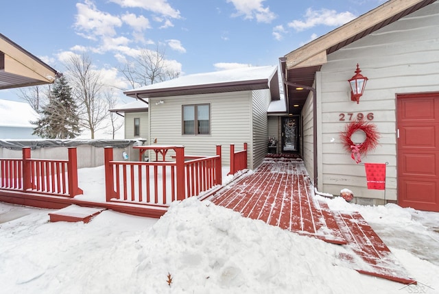 view of snow covered deck