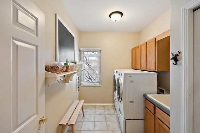 laundry area featuring cabinets and washer and dryer