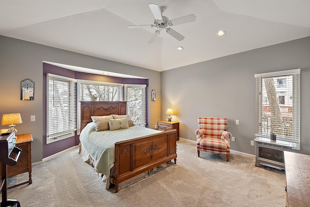 carpeted bedroom featuring ceiling fan and vaulted ceiling