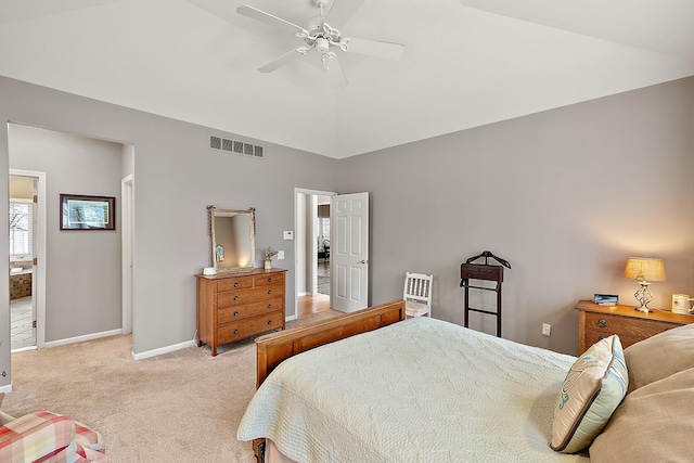 bedroom featuring ceiling fan, light colored carpet, and vaulted ceiling