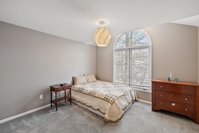 bedroom with light colored carpet