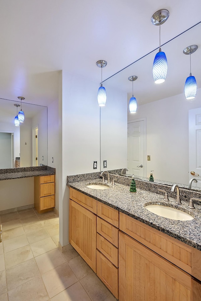 bathroom featuring tile patterned floors and vanity