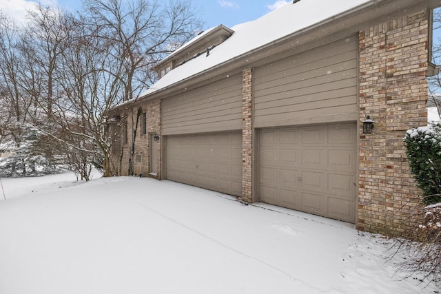 view of snow covered garage