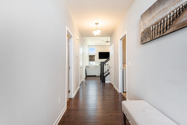 hallway with dark hardwood / wood-style flooring