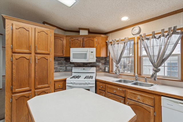 kitchen featuring sink, a textured ceiling, white appliances, decorative backsplash, and ornamental molding