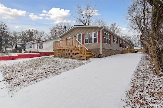 view of front of home with a deck