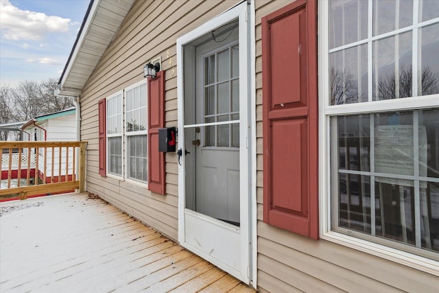 entrance to property with a deck