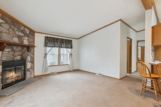 unfurnished living room with light colored carpet, ornamental molding, and a fireplace