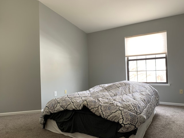 carpeted bedroom with baseboards