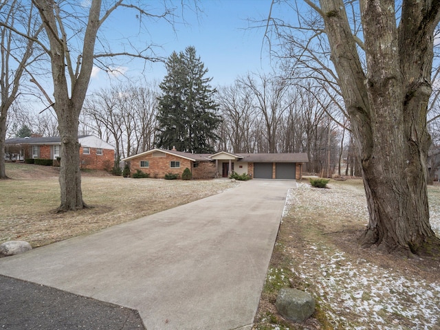 ranch-style house with a front lawn and a garage