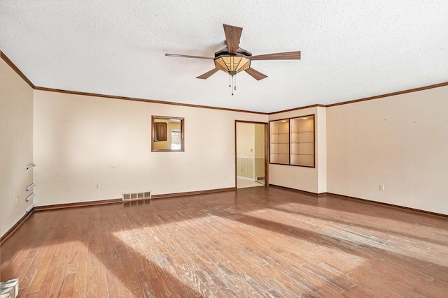 unfurnished room featuring wood-type flooring, ornamental molding, and ceiling fan