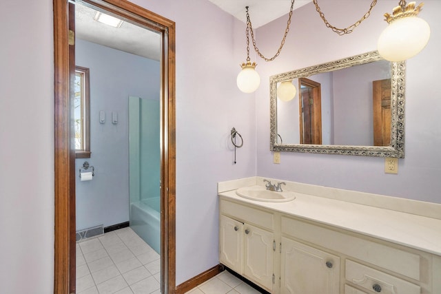 bathroom featuring vanity, plus walk in shower, and tile patterned flooring