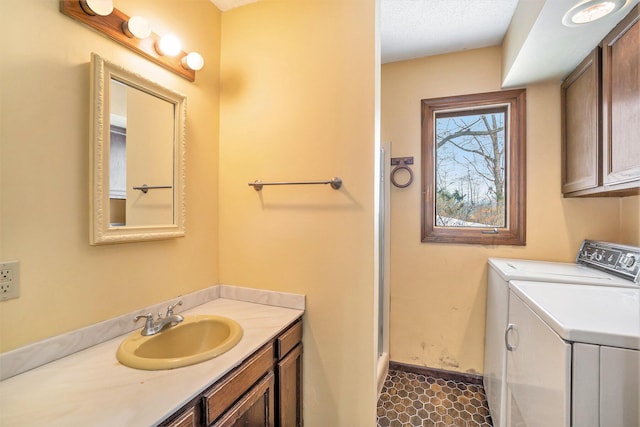 bathroom with vanity and washing machine and dryer