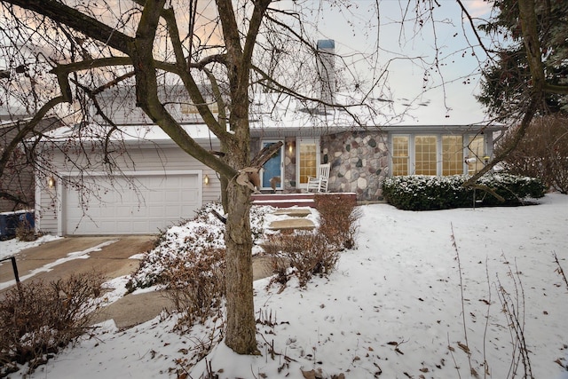 ranch-style house featuring a garage