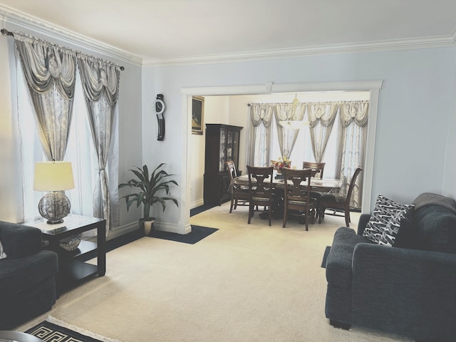 living room with carpet, a wealth of natural light, and ornamental molding