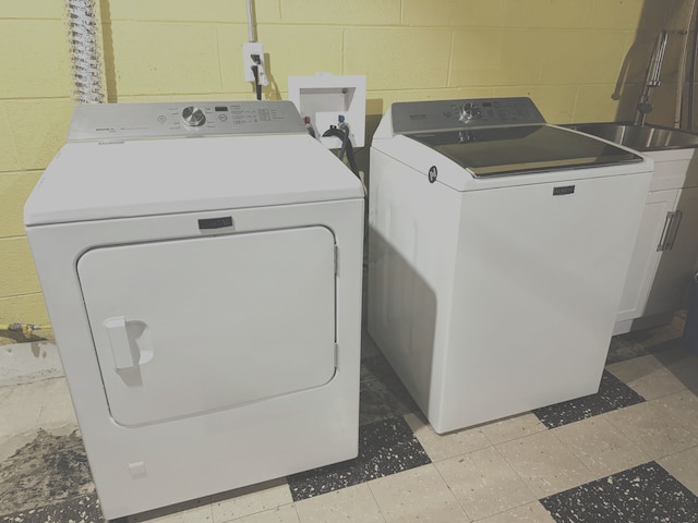 washroom with washer and dryer