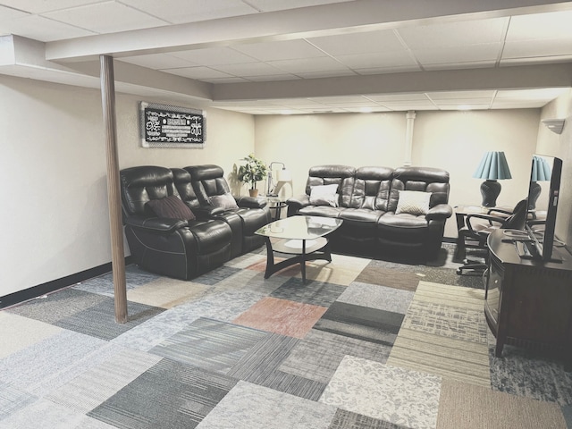 living room with carpet and a paneled ceiling