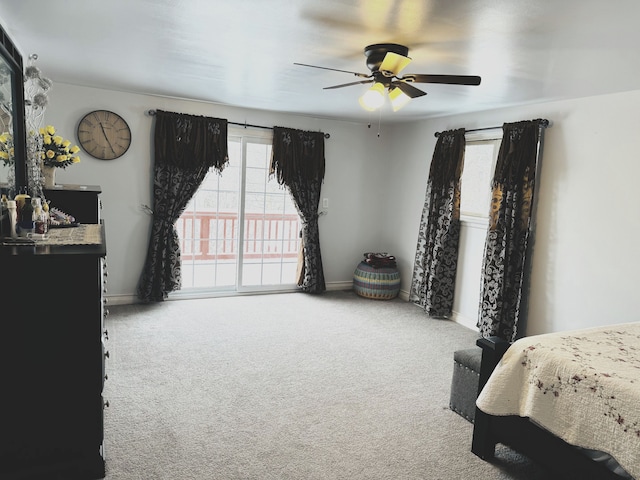 bedroom with access to exterior, carpet, multiple windows, and ceiling fan