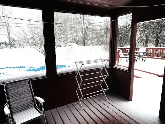 sunroom / solarium featuring wooden ceiling