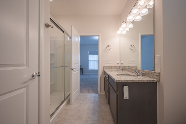 bathroom with vanity and walk in shower