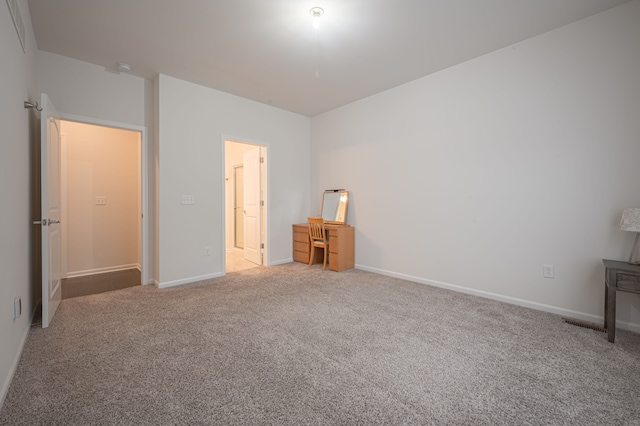 unfurnished bedroom featuring carpet flooring