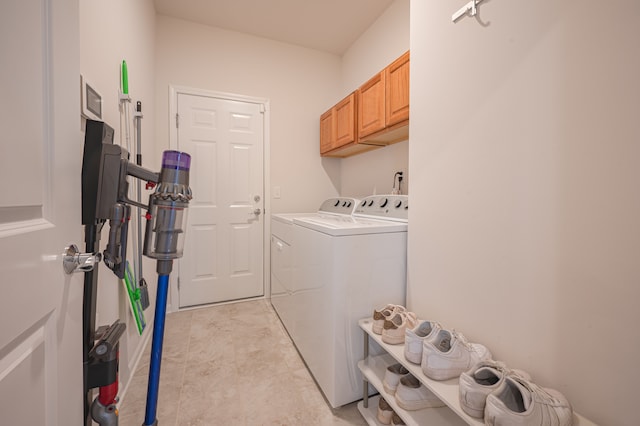 laundry area featuring cabinets and washer and dryer