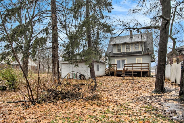 back of house featuring a deck