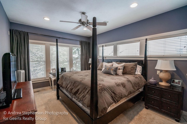 bedroom featuring recessed lighting, light colored carpet, ceiling fan, and baseboards