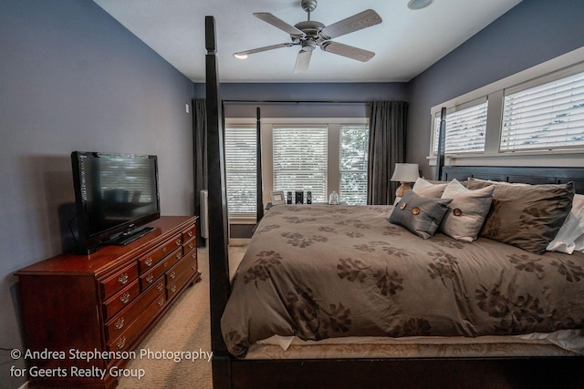 bedroom featuring light carpet and ceiling fan