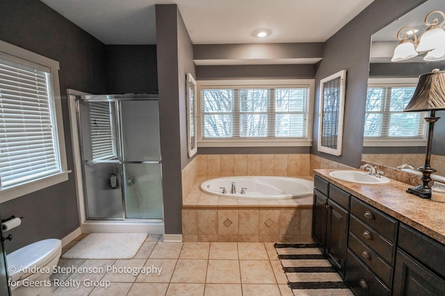 full bathroom with toilet, a shower stall, vanity, tile patterned flooring, and a bath