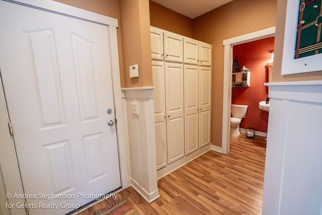 interior space with light wood-type flooring and baseboards