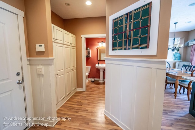 corridor with recessed lighting and light wood-style flooring