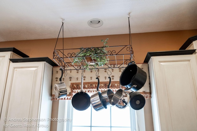 interior details featuring a textured ceiling