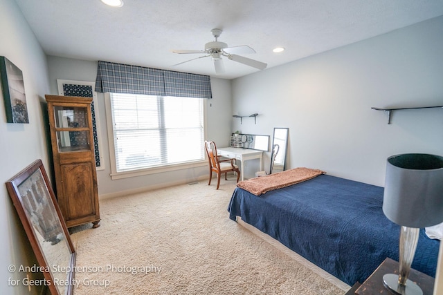 bedroom featuring light carpet, ceiling fan, baseboards, and recessed lighting