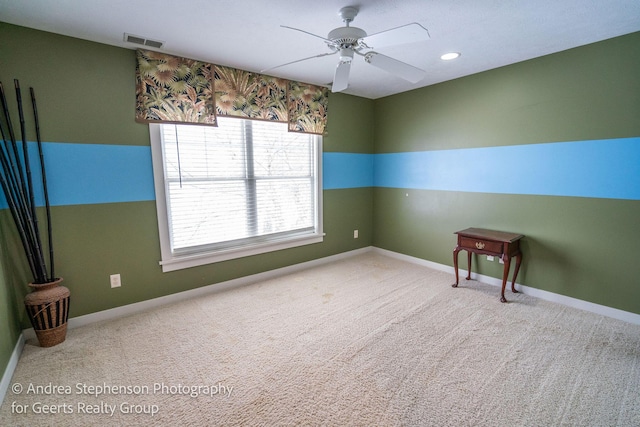 carpeted spare room with a ceiling fan, recessed lighting, visible vents, and baseboards