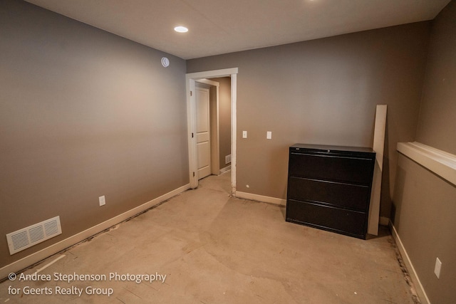 spare room featuring recessed lighting, visible vents, and baseboards