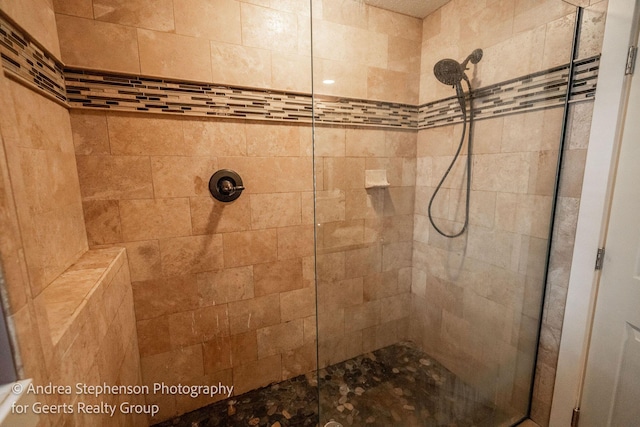 bathroom with a tile shower