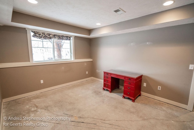 unfurnished office with recessed lighting, visible vents, a textured ceiling, concrete floors, and baseboards