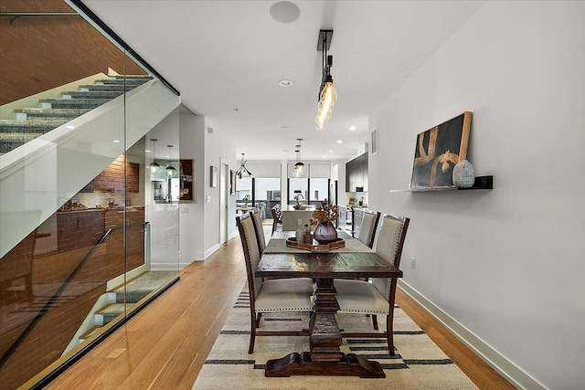 dining space with baseboards, visible vents, light wood-style floors, and recessed lighting
