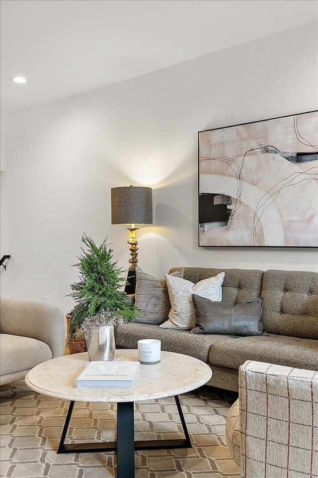 living area featuring brick floor and recessed lighting