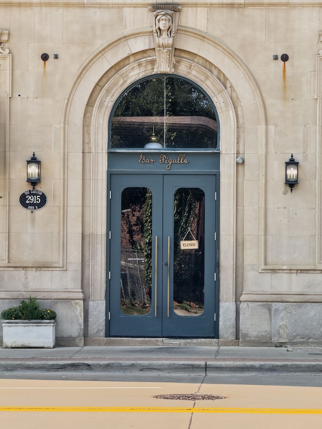 entrance to property featuring stone siding
