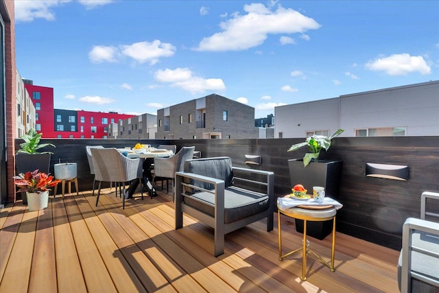 wooden deck featuring a city view