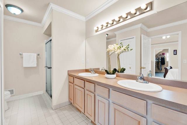 bathroom with toilet, tile patterned floors, vanity, ornamental molding, and a shower with shower door