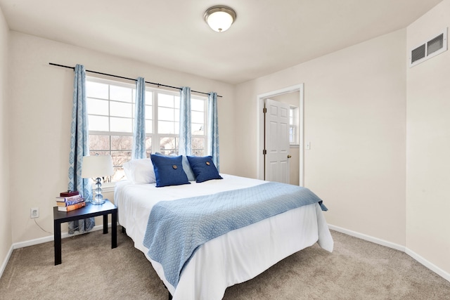 bedroom with light carpet