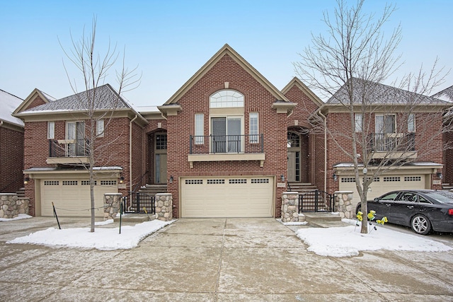 view of front of home featuring a balcony and a garage