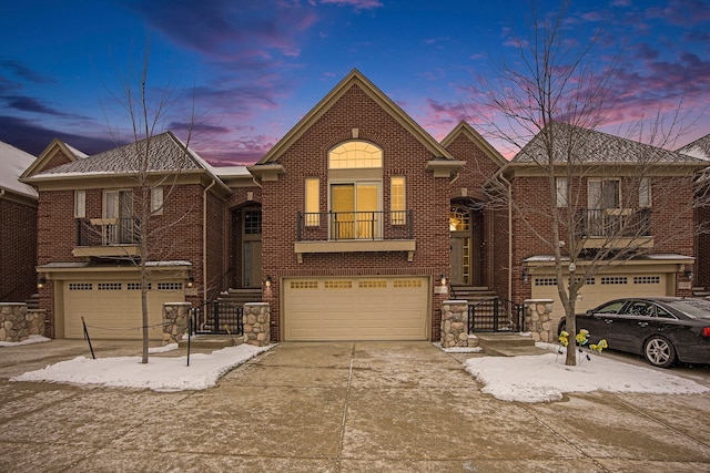 view of front of home featuring a balcony and a garage