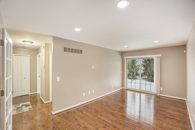 unfurnished room featuring hardwood / wood-style floors