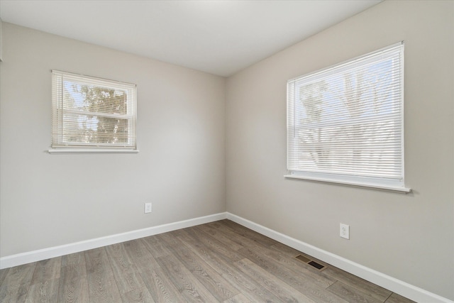 unfurnished room featuring light wood-type flooring