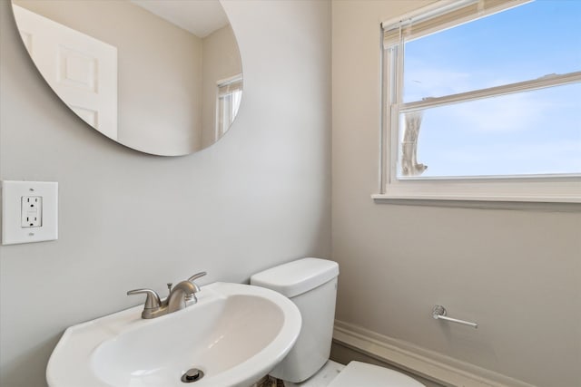 bathroom with toilet and sink