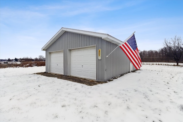 view of snow covered garage